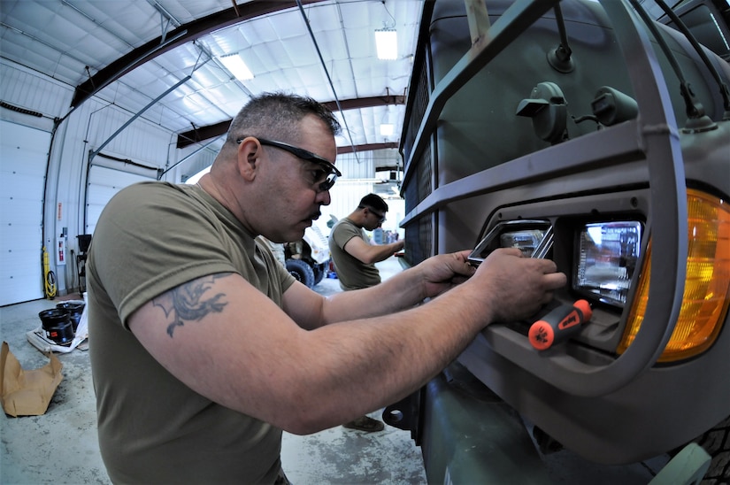 Mechanics from military police units turn wrenches during Operation Platinum Wrench