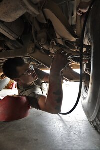 Mechanics from military police units turn wrenches during Operation Platinum Wrench