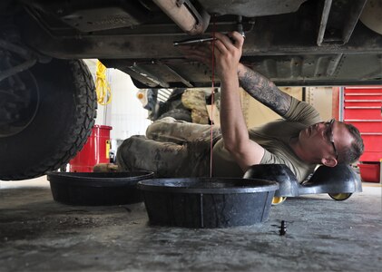 Mechanics from military police units turn wrenches during Operation Platinum Wrench