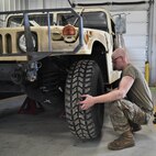 Mechanics from military police units turn wrenches during Operation Platinum Wrench