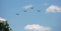 A flyover is conducted during the interment service of John W. Warner III, the 61st Secretary of the Navy and former senator for Virginia, at Arlington National Cemetery in Arlington, Va., June 23, 2021