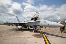 U.S. Marine Corps Capt. Mark Moeller, left, an F/A – 18 pilot with Marine Fighter Attack Squadron (VMFA) 115, explains different equipment in the cock-pit of an F/A -18 to Cody Ware, right, a NASCAR driver, at Marine Corps Air Station (MCAS) Beaufort, South Carolina, Sept. 1, 2021.