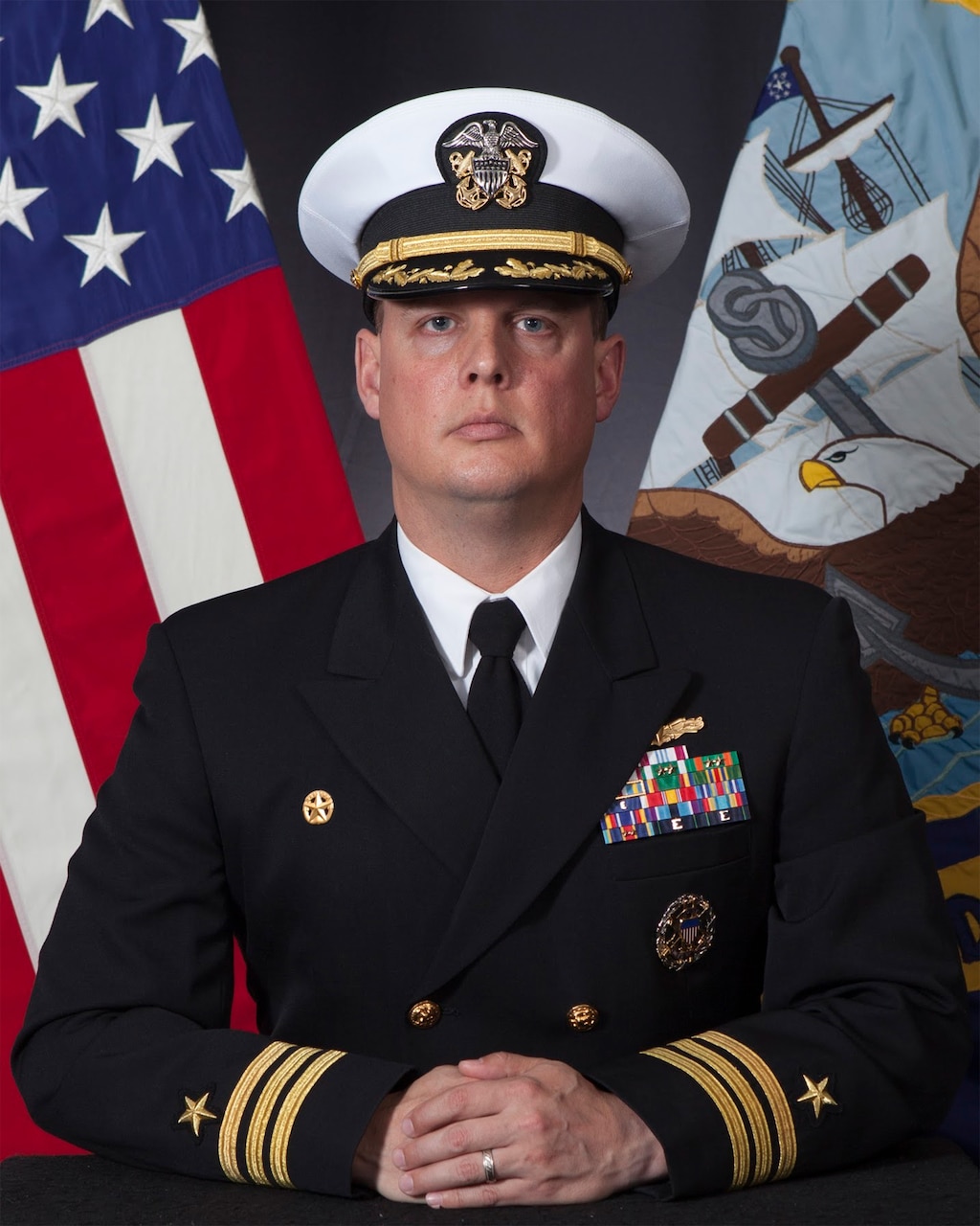 Official studio portrait of Cmdr. Brad Fancher, commanding officer, USS Carter Hall (LSD 50)