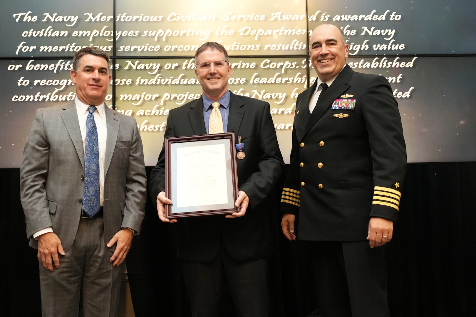 IMAGE: Mark Giewont receives the Navy Meritorious Civilian Service Award at the 2021 Naval Surface Warfare Center Dahlgren Division (NSWCDD) Honorary Awards ceremony, June 17. Standing left to right: NSWCDD Technical Director, Dale Sisson, SES, Giewont and NSWCDD Commanding Officer, Capt. Philip Mlynarski.