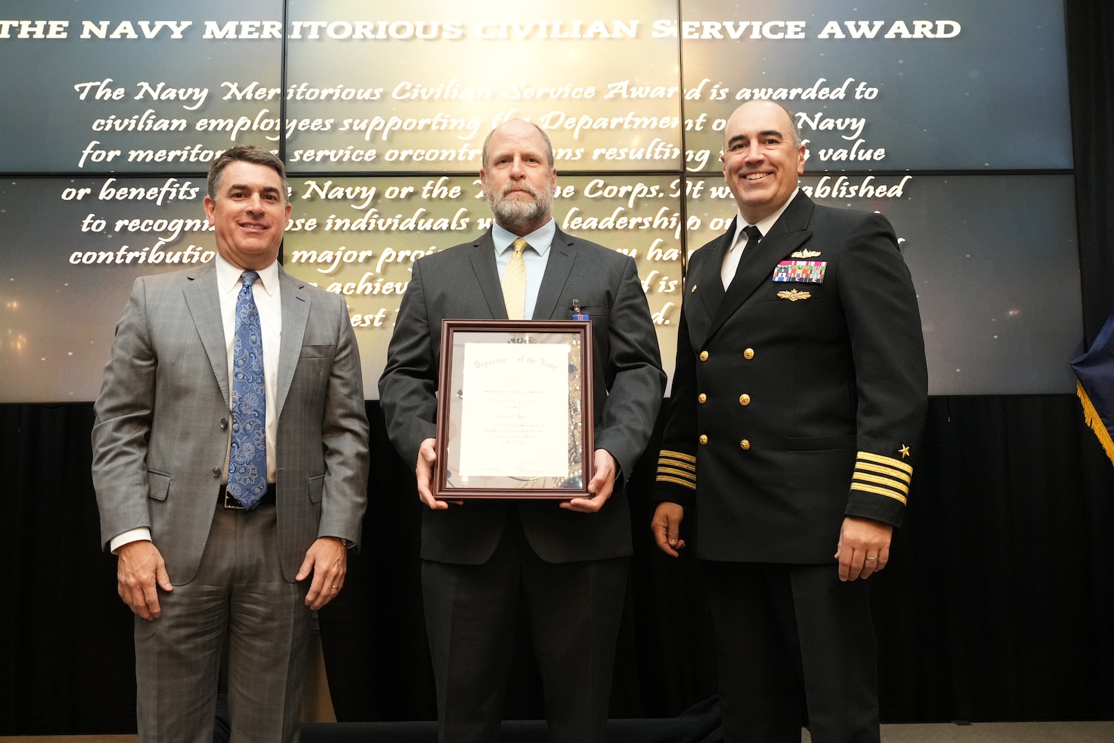 IMAGE: John Jims receives the Navy Meritorious Civilian Service Award at the 2021 Naval Surface Warfare Center Dahlgren Division (NSWCDD) Honorary Awards ceremony, June 17. Standing left to right: NSWCDD Technical Director, Dale Sisson, SES, Jims and NSWCDD Commanding Officer, Capt. Philip Mlynarski.