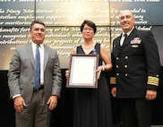 IMAGE: Robin Ross receives the Navy Meritorious Civilian Service Award at the 2021 Naval Surface Warfare Center Dahlgren Division (NSWCDD) Honorary Awards ceremony, June 17. Standing left to right: NSWCDD Technical Director, Dale Sisson, SES, Ross and NSWCDD Commanding Officer, Capt. Philip Mlynarski.