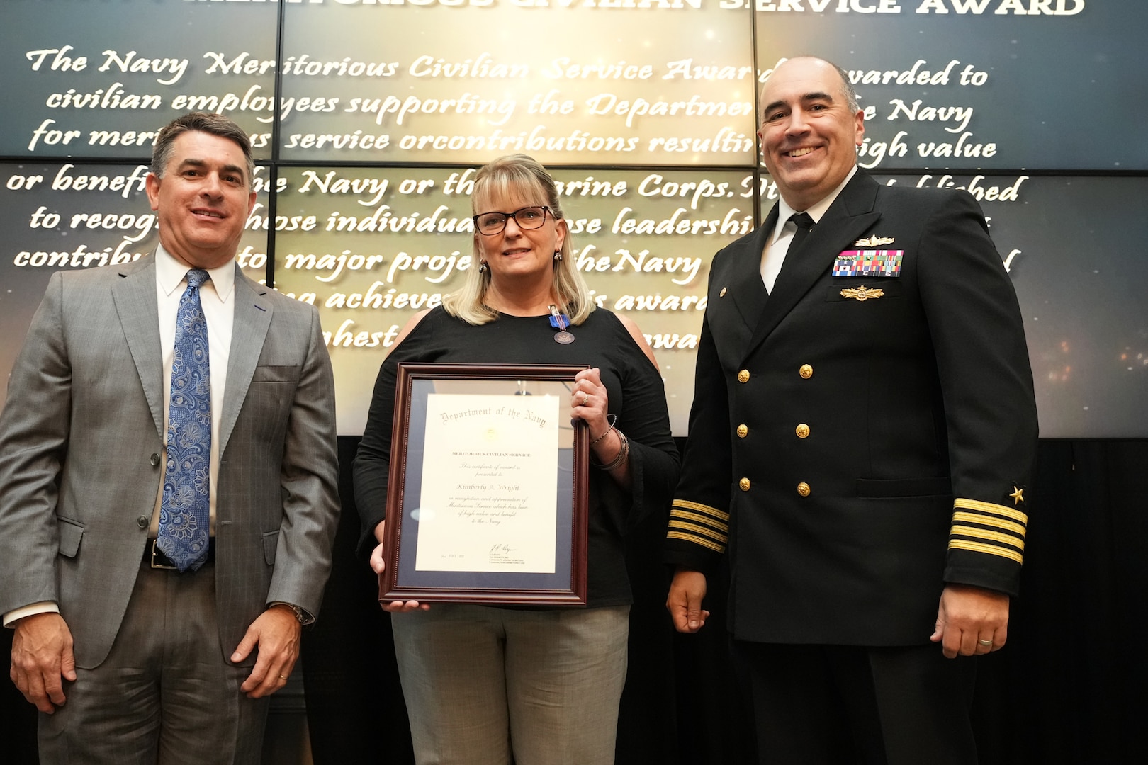 IMAGE: Kimberly Wright receives the Navy Meritorious Civilian Service Award at the 2021 Naval Surface Warfare Center Dahlgren Division (NSWCDD) Honorary Awards ceremony, June 17. Standing left to right: NSWCDD Technical Director, Dale Sisson, SES, Wright and NSWCDD Commanding Officer, Capt. Philip Mlynarski.