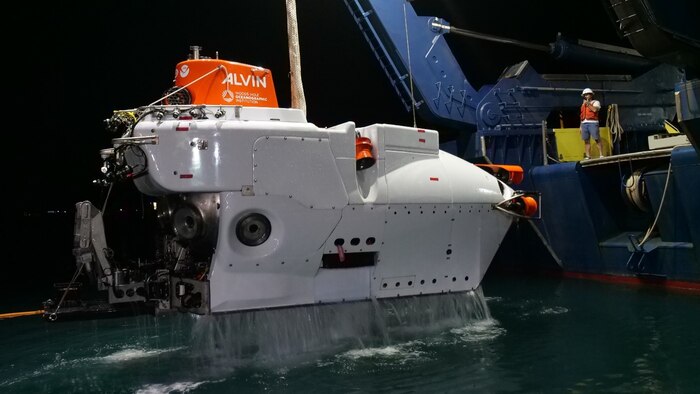 Deep Submergence Vehicle Alvin is lifted from the water by a crane on RV Atlantis