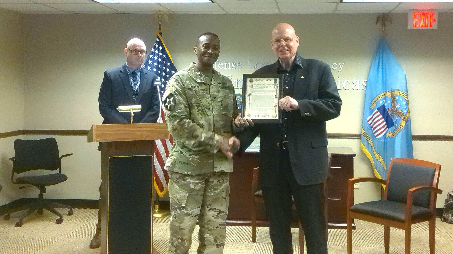 DLA Energy Americas Commander Army Col. Raphael Heflin shakes hands with Dave Ray