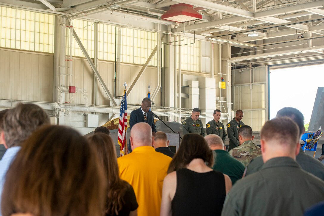 Attendees conduct a moment of silence.