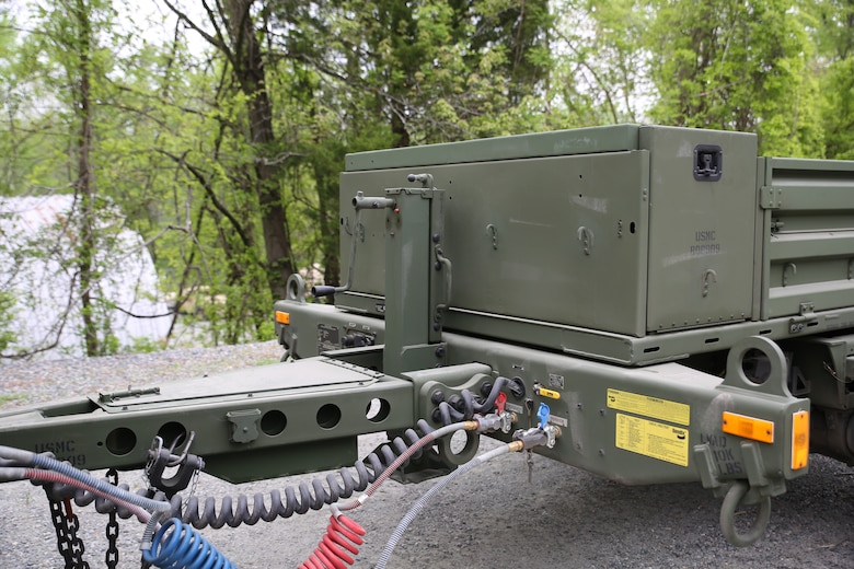 The Marine Corps’ new JLTV-Trailer comes loaded with features such as a 12v electrical hookup in the front, a storage compartment, a step assist in the rear, and removable side rails. Marine Expeditionary Units and Divisions are expected to concurrently receive initial shipments of the trailer beginning fiscal year 2022. (U.S. Marine Corps photo by Samantha Bates)