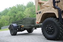 The Marine Corps’ new JLTV trailer comes loaded with features such as a step assist in the rear, air brakes, removable side rails, a 12v electrical hookup in the front and a storage compartment. Offering 147 cubic feet of storage space and already coming painted green from the factory, the JLTV-T propels the light tactical vehicle fleet toward Force Design 2030. Marine Expeditionary Units and Divisions are expected to concurrently receive initial shipments of the trailer beginning fiscal year 2022. (U.S. Marine Corps photo by Samantha Bates)