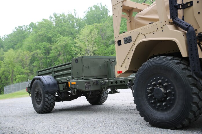 The Marine Corps’ new JLTV trailer comes loaded with features such as a step assist in the rear, air brakes, removable side rails, a 12v electrical hookup in the front and a storage compartment. Offering 147 cubic feet of storage space and already coming painted green from the factory, the JLTV-T propels the light tactical vehicle fleet toward Force Design 2030. Marine Expeditionary Units and Divisions are expected to concurrently receive initial shipments of the trailer beginning fiscal year 2022. (U.S. Marine Corps photo by Samantha Bates)