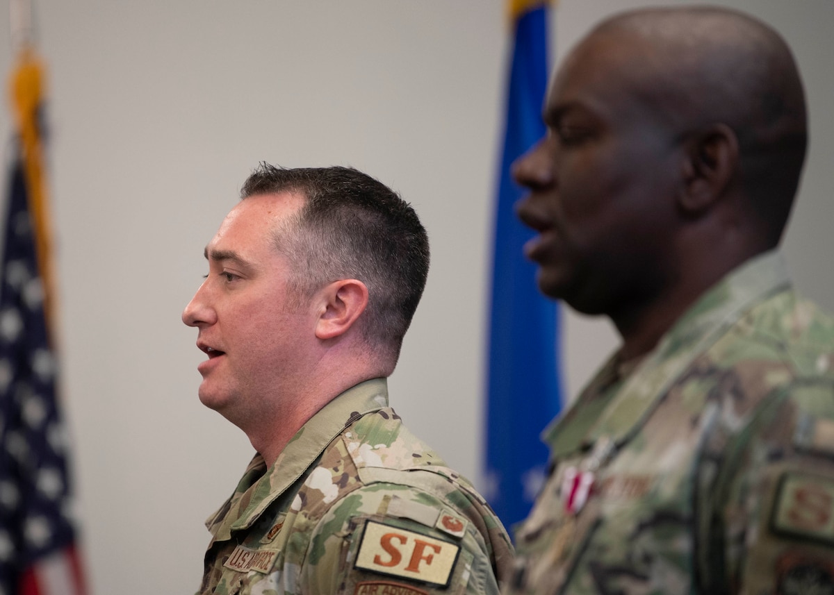 Maj. David Ratté, 436th Security Forces Squadron commander, sings the Air Force Song during a change of command ceremony held at The Landings on Dover Air Force Base, Delaware, June 21, 2022. Ratté was previously the 768th Expeditionary Air Base Squadron defense force commander. (U.S. Air Force photo by TSgt. J.D. Strong II)