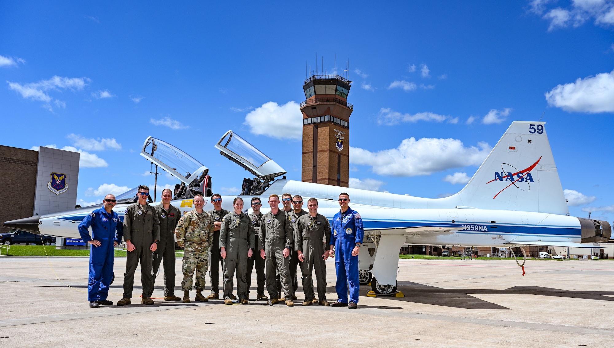 U.S. Air Force Airmen and NASA personnel discuss the T-38N Talon at Whiteman Air Force Base, Missouri, June 7, 2022. NASA employs the T-38N Talon to prepare astronauts and aircrews to respond to events that may jeopardize the mission. Both the 509th Bomb Wing and NASA utilize the T-38 program to ensure mission readiness.