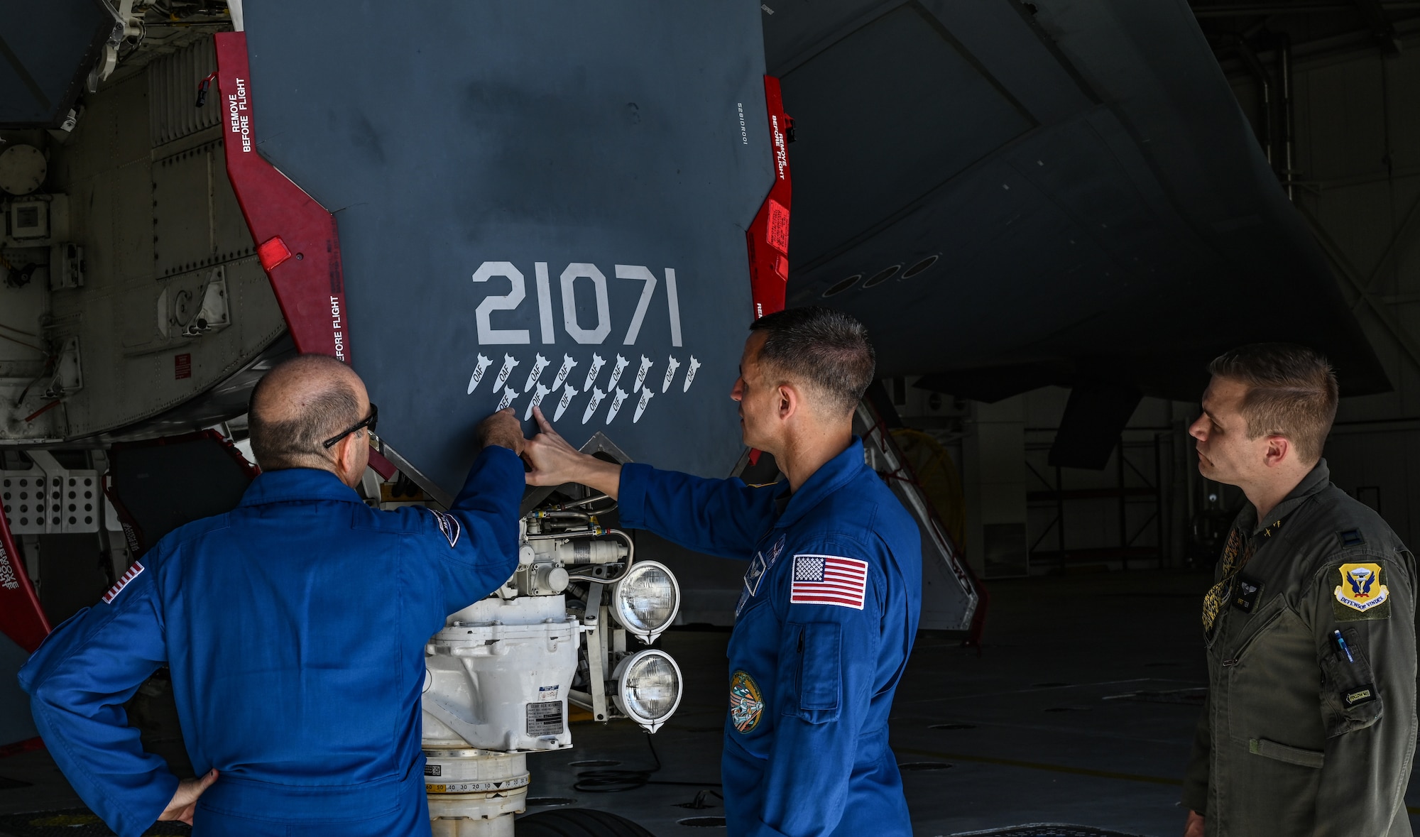 U.S. Army Col. Andrew Morgan, NASA astronaut and Army NASA Detachment commander, Tom Parent, NASA Aircraft Operations Division pilot and a B-2 Spirit pilot look over the B-2 Spirit at Whiteman Air Force Base, Missouri, June 7, 2022. NASA and the 509th Bomb Wing engaged in cross-organizational communication, discussing common mission components between the two organizations. Finding new ways to enhance current partnerships ensures innovation and growth, allowing men and women of the 509th BW to maintain the most lethal combat force in the world.