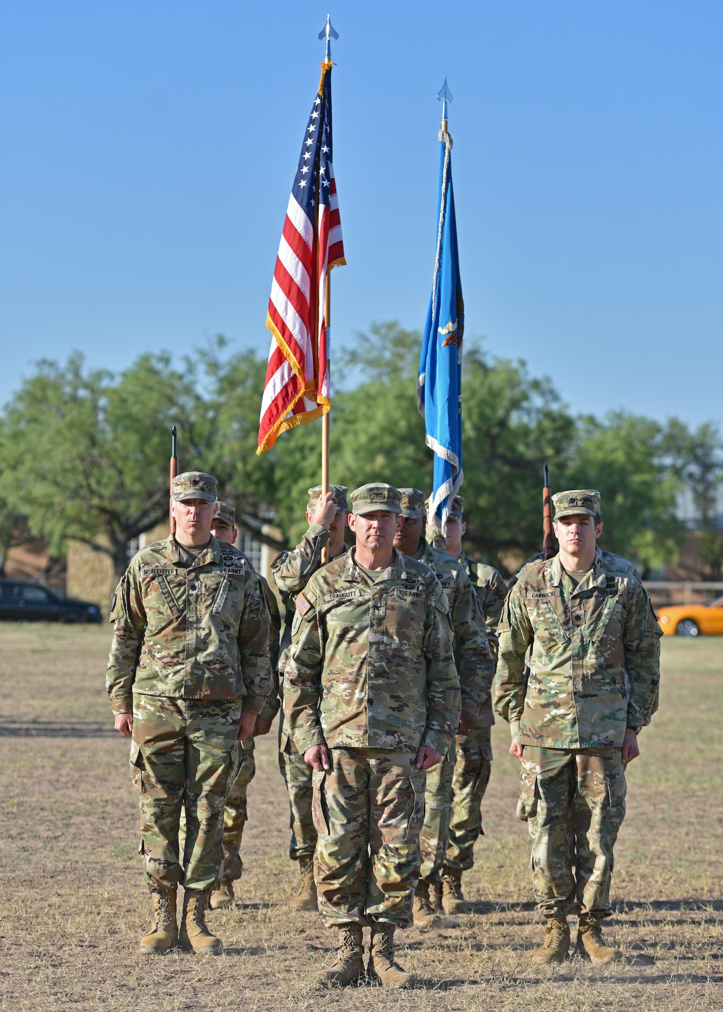 U.S. Army Lt. Col. Joseph Garwacki, outgoing 344th Military Intelligence Battalion commander, Col. Loren Traugutt, 111th Military Intelligence Brigade commander, and Lt. Col. John McAllister, incoming 344th MI BN commander, stand at attention during the 344th MI BN change of command ceremony at Fort Concho, San Angelo, Texas, June 21, 2022. Traugutt oversaw the transfer of command from Garwacki to McAllister. (U.S. Air Force photo by Senior Airman Ashley Thrash)