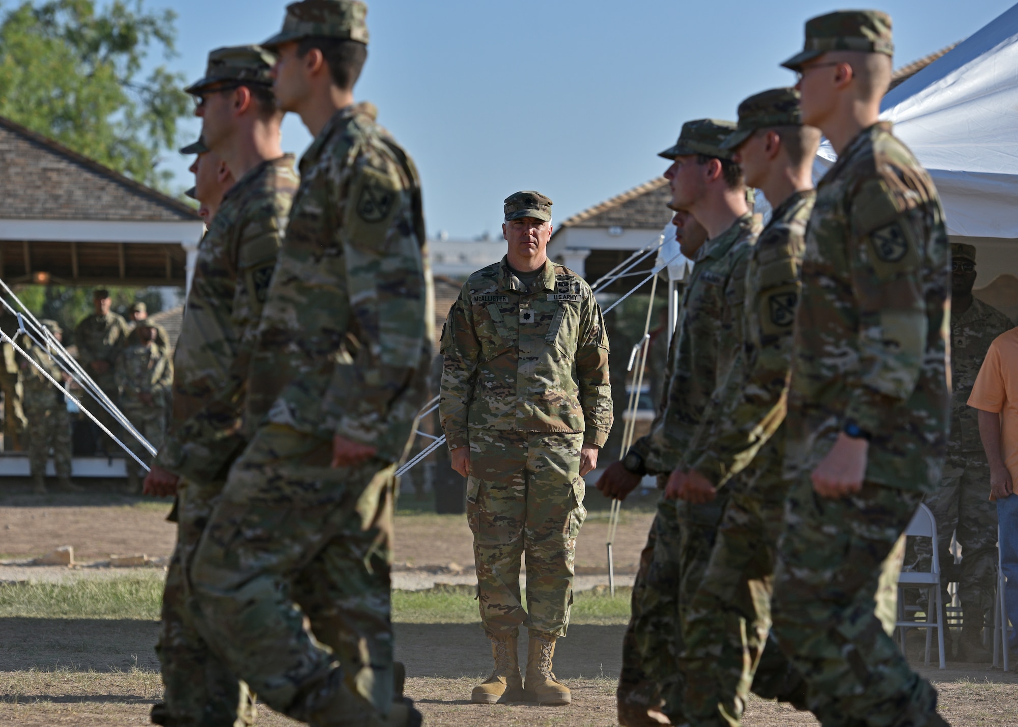 U.S. Army Soldiers assigned to the 344th Military Intelligence Battalion march past Lt. Col. John McAllister, incoming 344th MI BN commander, during the Pass and Review portion of the 344th MI BN change of command ceremony at Fort Concho, San Angelo, Texas, June 21, 2022. Pass and Review is a long-standing military tradition which began as a way for newly assigned commanders to inspect his or her new troops. (U.S. Air Force photo by Senior Airman Ashley Thrash)