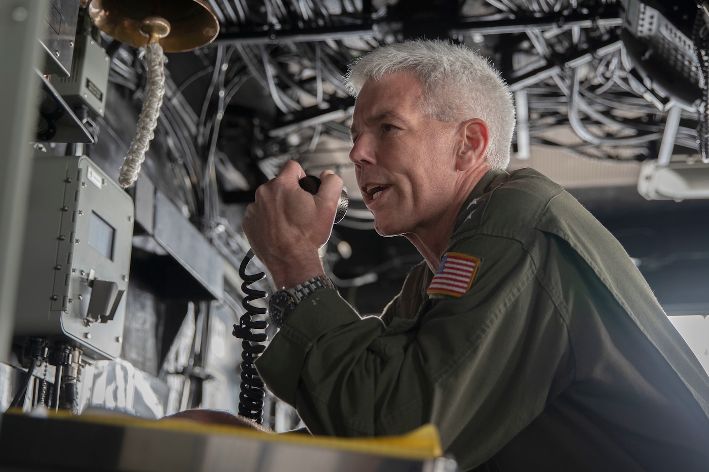 PACIFIC OCEAN (June 10, 2022) – Vice Adm. Karl Thomas, commander, U.S. 7th Fleet, addresses the crew of amphibious assault carrier USS Tripoli (LHA 7), over the ship’s 1MC, June 10, 2022. Tripoli is operating in the U.S. 7th Fleet area of operations to enhance interoperability with allies and partners and serve as a ready response force to defend peace and maintain stability in the Indo-Pacific region.  (U.S. Navy photo by Mass Communication Specialist 1st Class Peter Burghart)