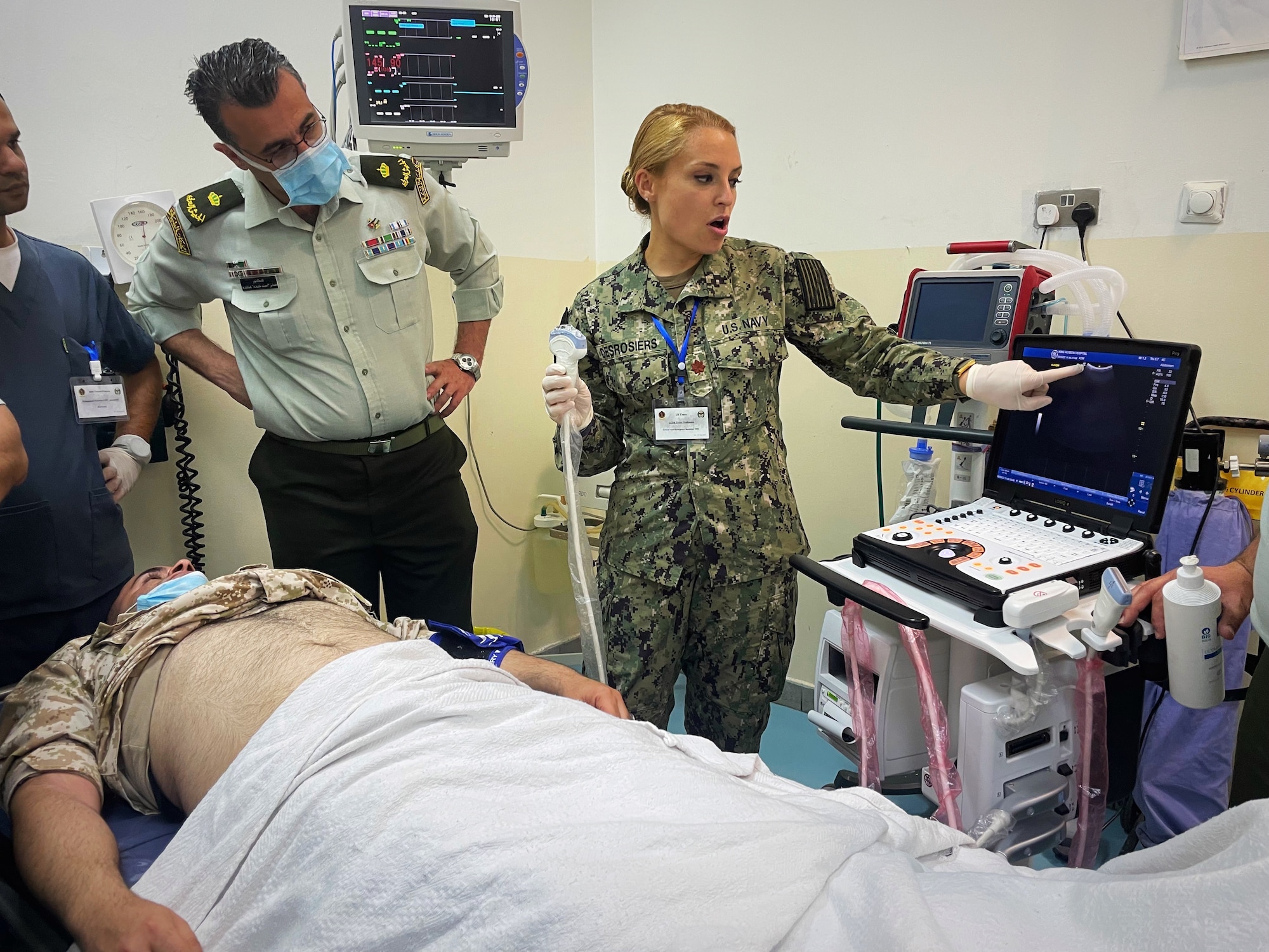 Lt. Cmdr. Taylor DesRosiers, Walter Reed Medical Center critical care fellow, points to a structure on an ultrasound machine screen prior to providing a demonstration of various techniques inside the King Hussein Medical Center May 9, 2022 in Amman, Jordan.