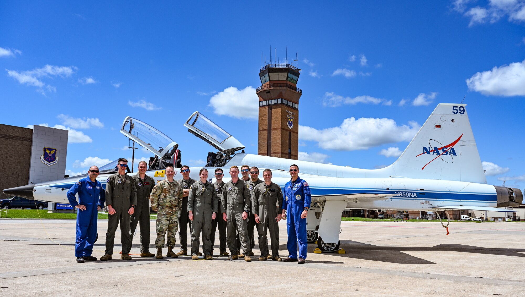 U.S. Air Force Airmen and NASA personnel discuss the T-38N Talon at Whiteman Air Force Base, Missouri, June 7, 2022. NASA employs the T-38N Talon to prepare astronauts and aircrews to respond to events that may jeopardize the mission. Both the 509th Bomb Wing and NASA utilize the T-38 program to ensure mission readiness.