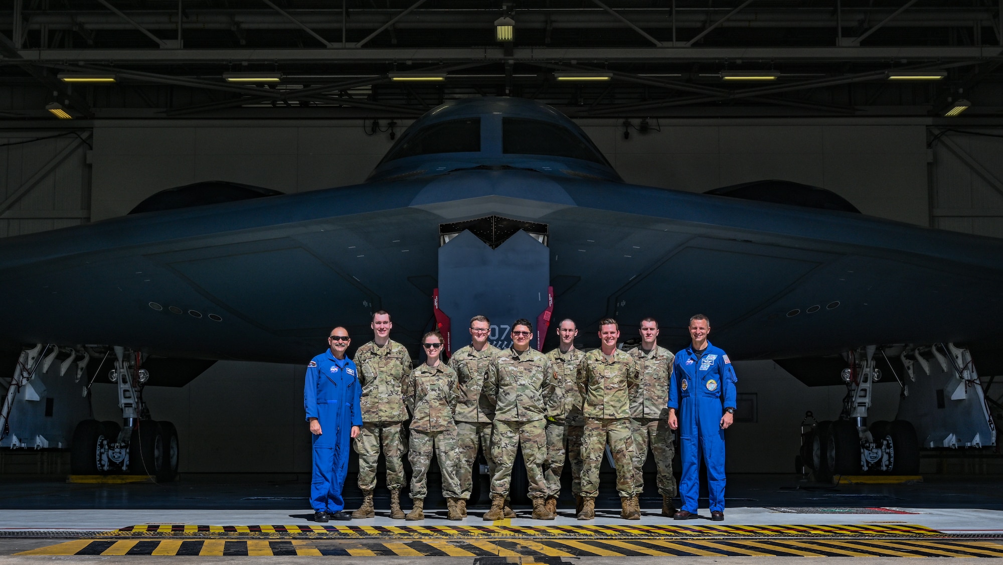 U.S. Air Force Airmen and NASA personnel pose in front of a U.S. Air Force B-2 Spirit stealth bomber at Whiteman Air Force Base, Missouri, June 7, 2022. NASA and the 509th Bomb Wing engaged in cross-organizational communication, discussing common mission components between the two organizations. Finding new ways to enhance current partnerships ensures innovation and growth, allowing men and women of the 509th BW to maintain the most lethal combat force in the world.