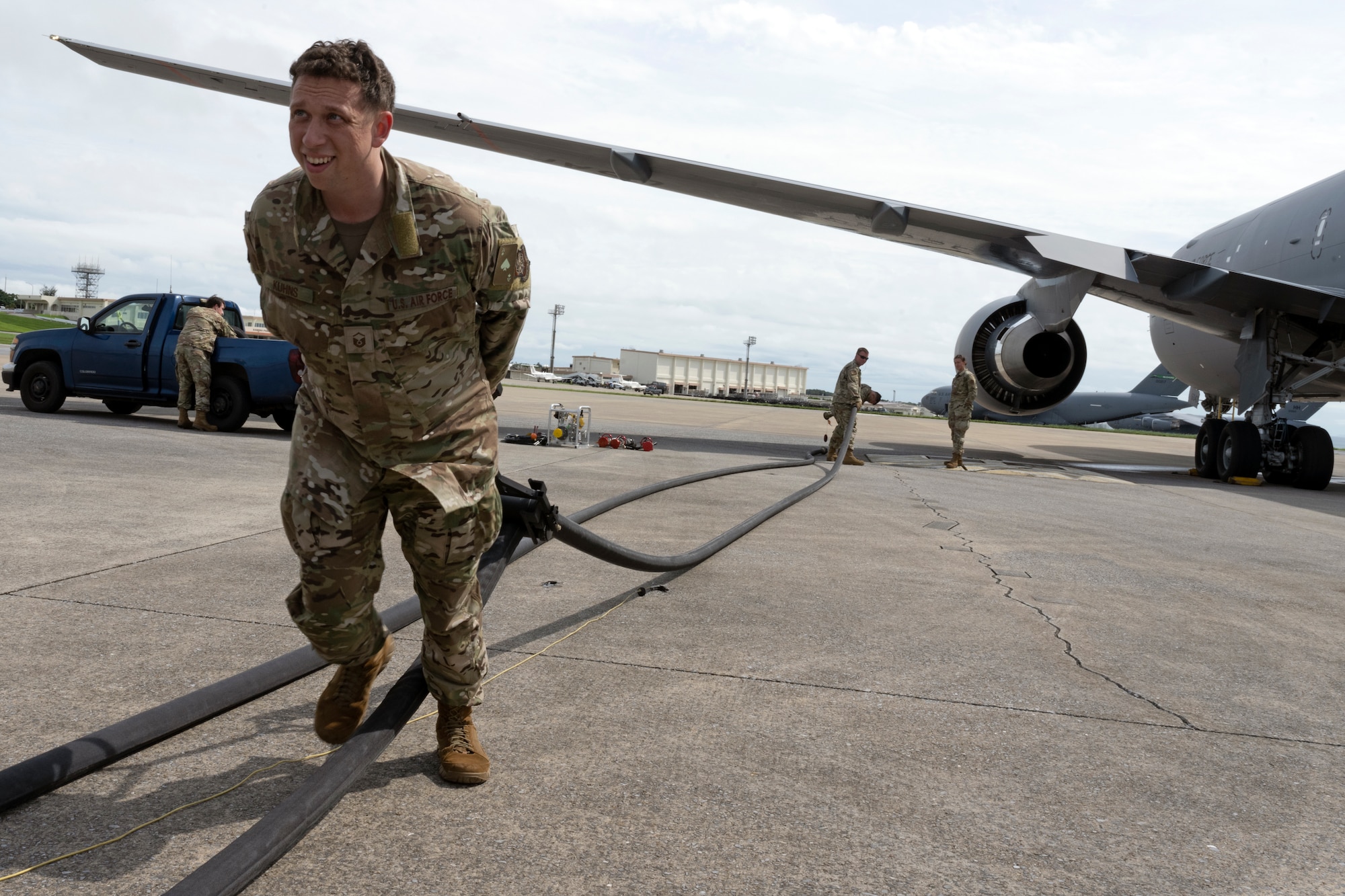 Master Sgt. Trevor Kuhns, 22nd Air Refueling Wing Agile Combat Employment team lead, extracts the remaining jet fuel in the lines to prevent fuel spillage during a test of a new fueling concept June 7, 2022, at Kadena Air Base, Japan. In support of the ACE initiative, the test involved sending gas from the tanker to the truck and could possibly open up the door for extensive future refueling operations. The McConnell aircrew and maintenance personnel visited with their counterparts to showcase KC-46A Pegasus capabilities for fuels servicing, cargo, and aeromedical evacuation. (U.S. Air Force photo by Master Sgt. John Gordinier)
