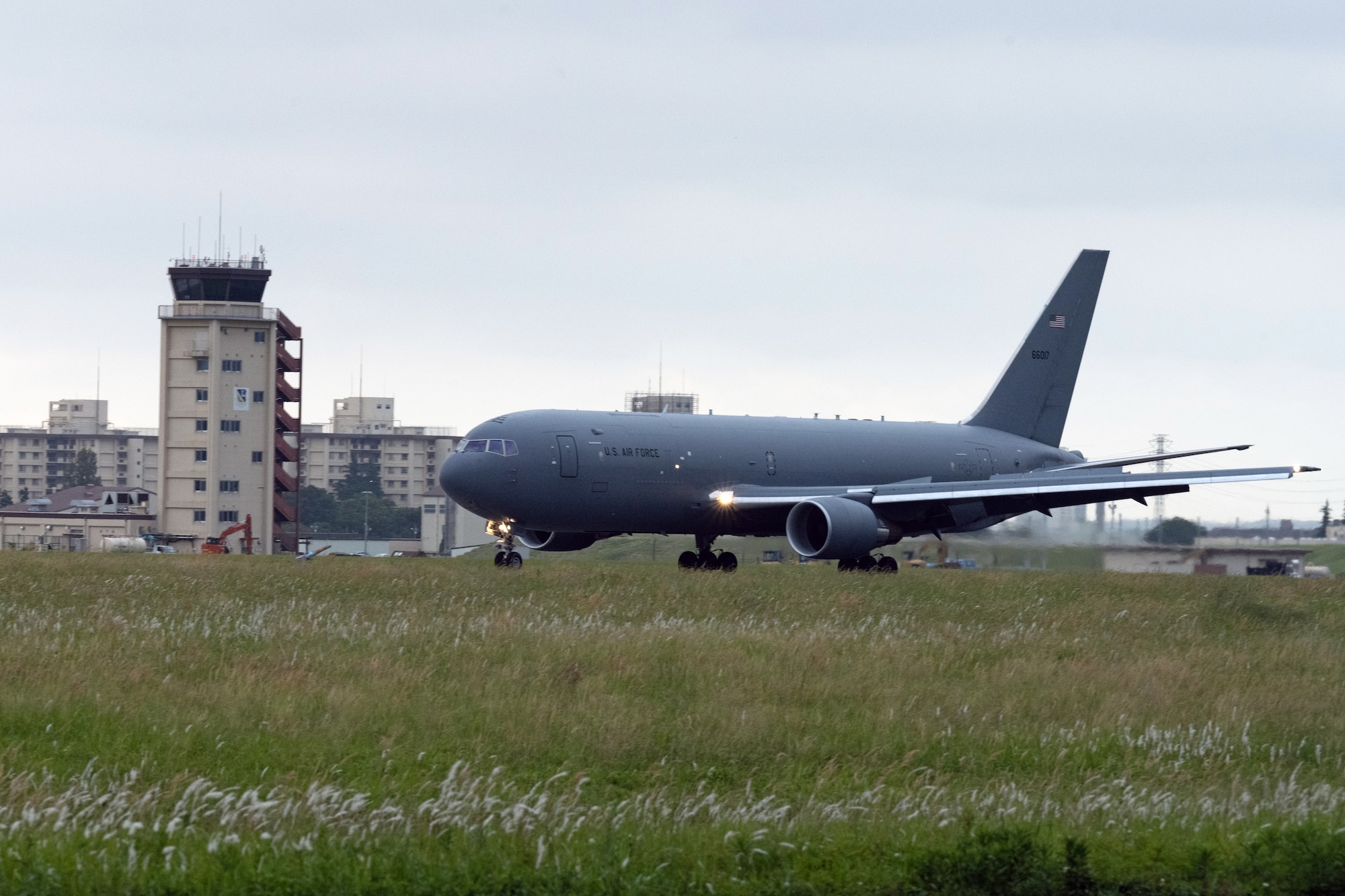 A KC-46A Pegasus from McConnell Air Force Base, Kansas, touches down on the runway June 8, 2022, at Yokota Air Base, Japan. The Pegasus is participating in Air Mobility Command’s Employment Concept Exercise 22-06 and provided air refueling operations to the Indo-Pacific Theater. The exercise focused on deployed integration of total force and joint training in a multi-domain environment to build real-world proficiency and readiness. (U.S. Air Force photo by Master Sgt. John Gordinier)
