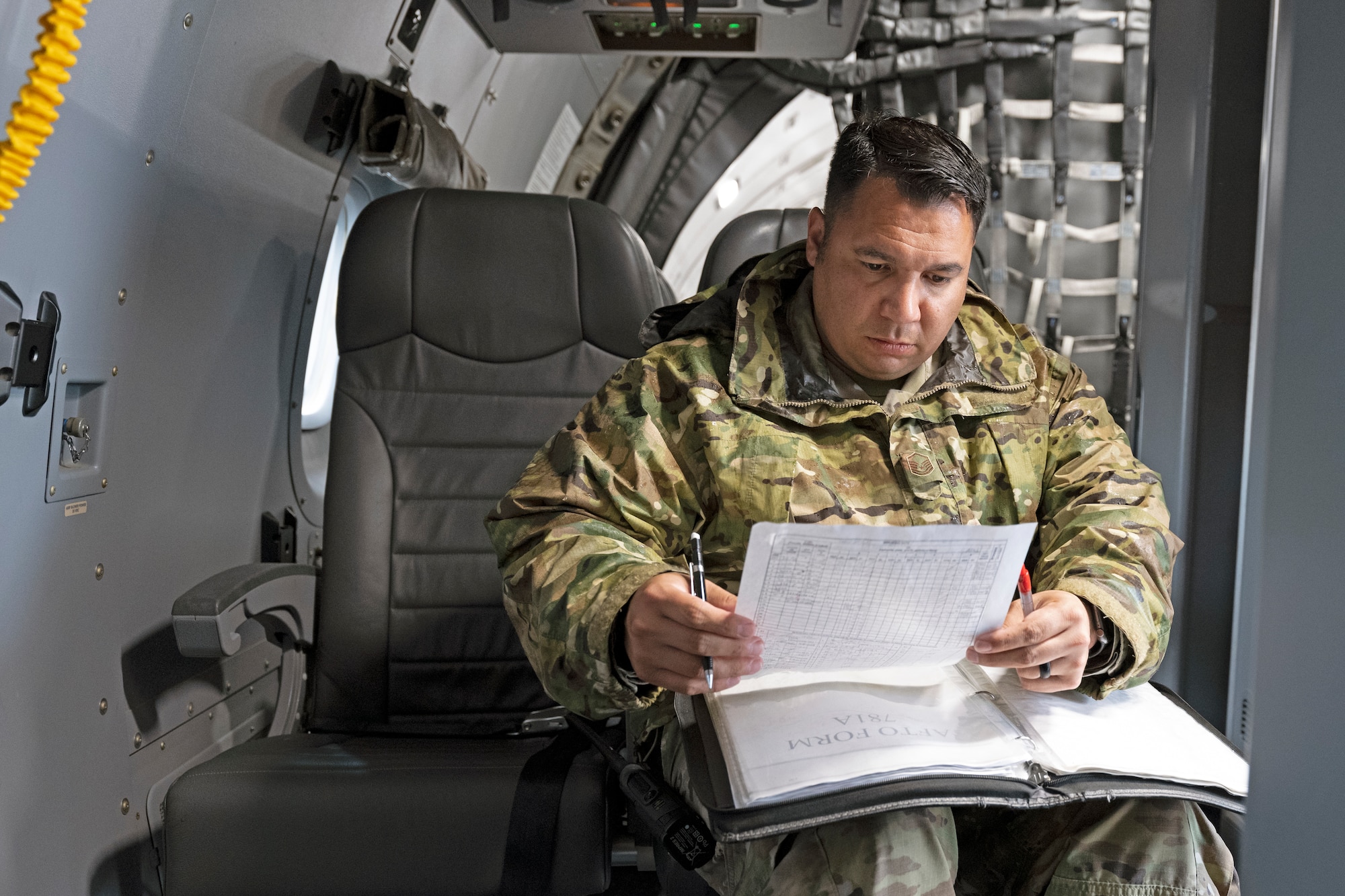 Senior Master Sgt. Roman Lugo, 22nd Aircraft Maintenance Squadron lead production superintendent, reviews maintenance inspections aboard a McConnell Air Force Base, Kansas, KC-46A Pegasus June 6, 2022, at Yokota Air Base, Japan. McConnell Pegasus, aircrew and maintenance personnel participated in Air Mobility Command’s Employment Concept Exercise 22-06 to test capabilities for world-wide employment and provide an opportunity for total force and joint training in a multi-domain environment. (U.S. Air Force photo by Master Sgt. John Gordinier)