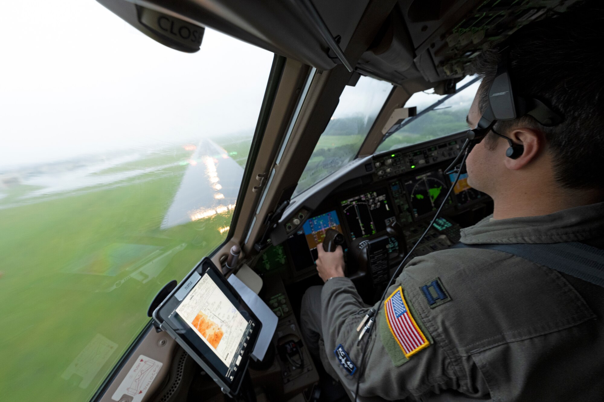 Captain Sebastian Constable, 22nd Operations Group KC-46A Pegasus pilot, approaches the runway of Yokota Air Base, Japan, during inclement weather June 7, 2022, during Air Mobility Command’s Employment Concept Exercise 22-06. The exercise tests aircrew and maintenance personnel in setting up operations abroad and ensuring air refueling mission capabilities in a deployed total force and joint environment. (U.S. Air Force photo by Master Sgt. John Gordinier)