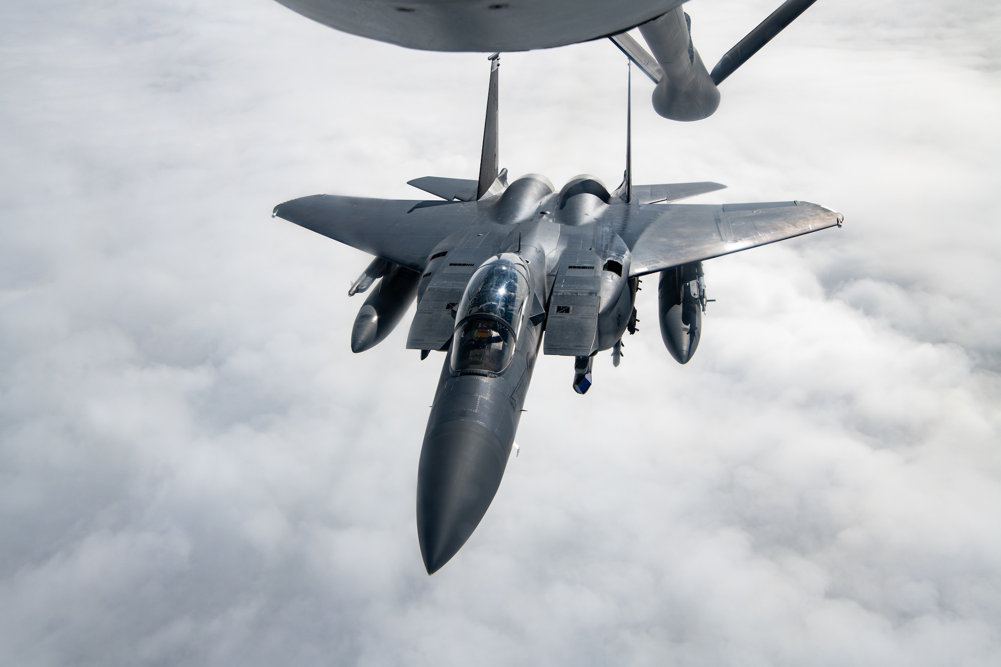 A Singapore jet performs aerial refueling.