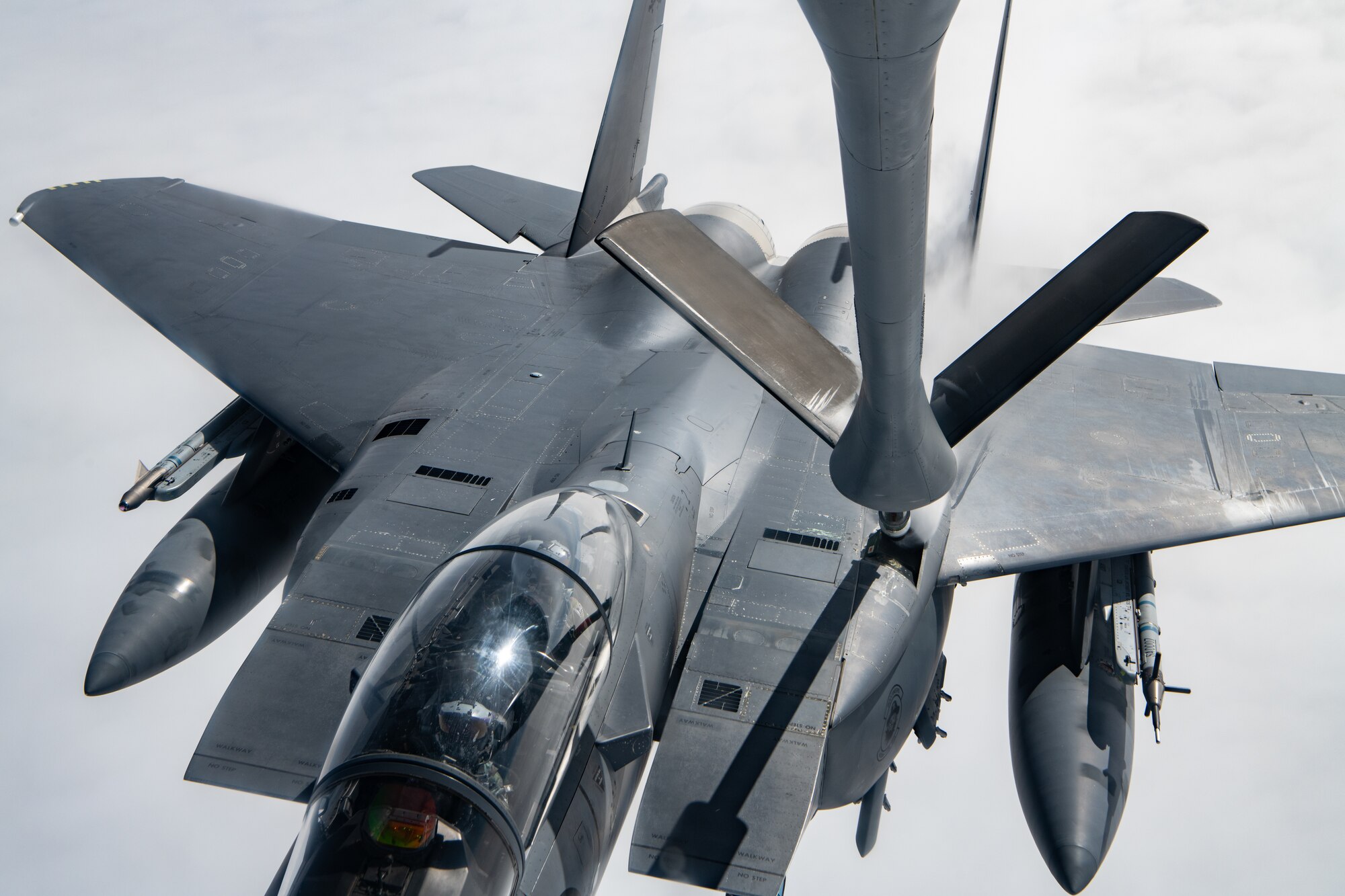 A Singapore jet performs aerial refueling.