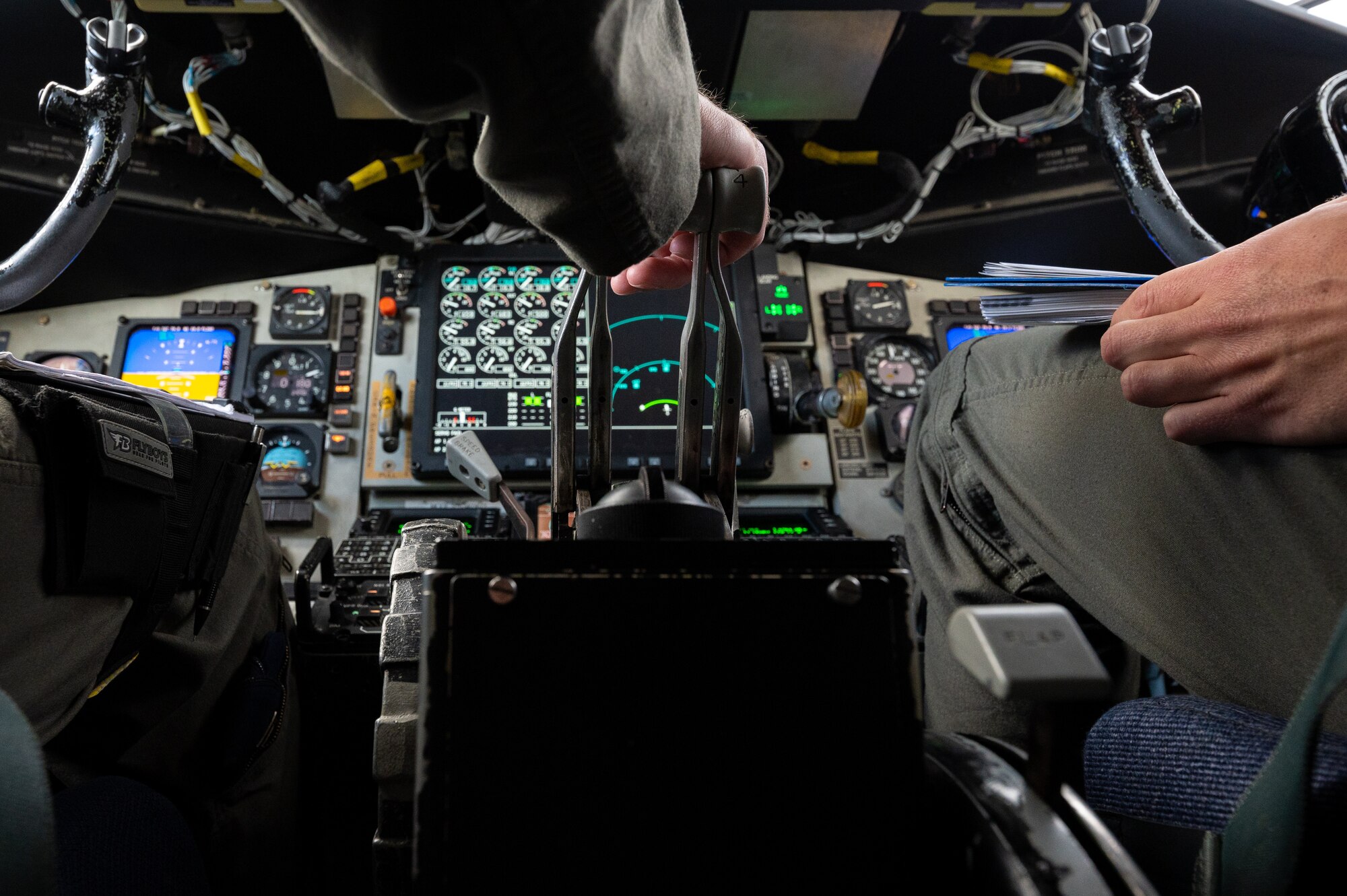Air Force pilots press on the throttle of a KC-135.