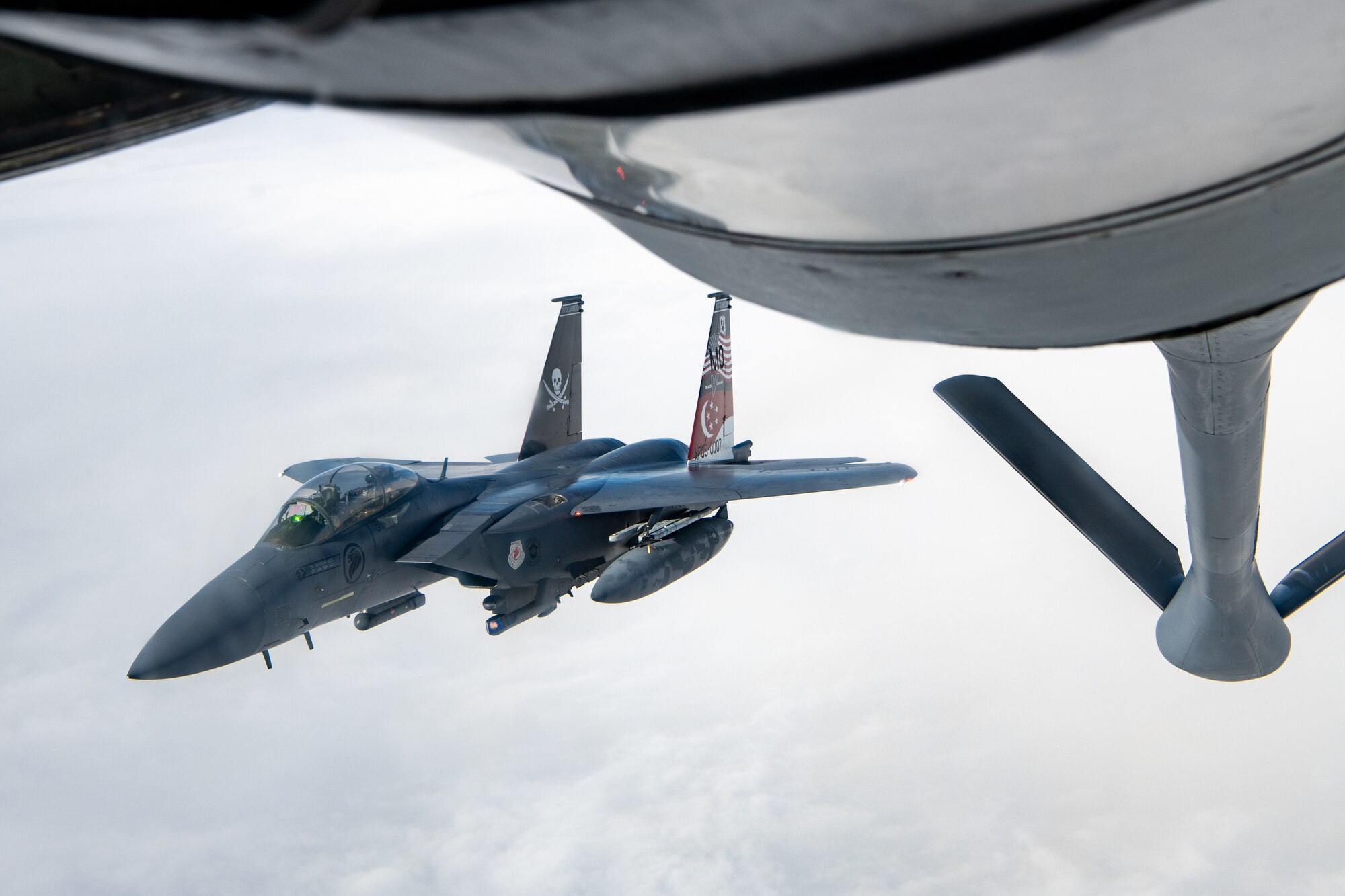 A Singapore jet performs aerial refueling.