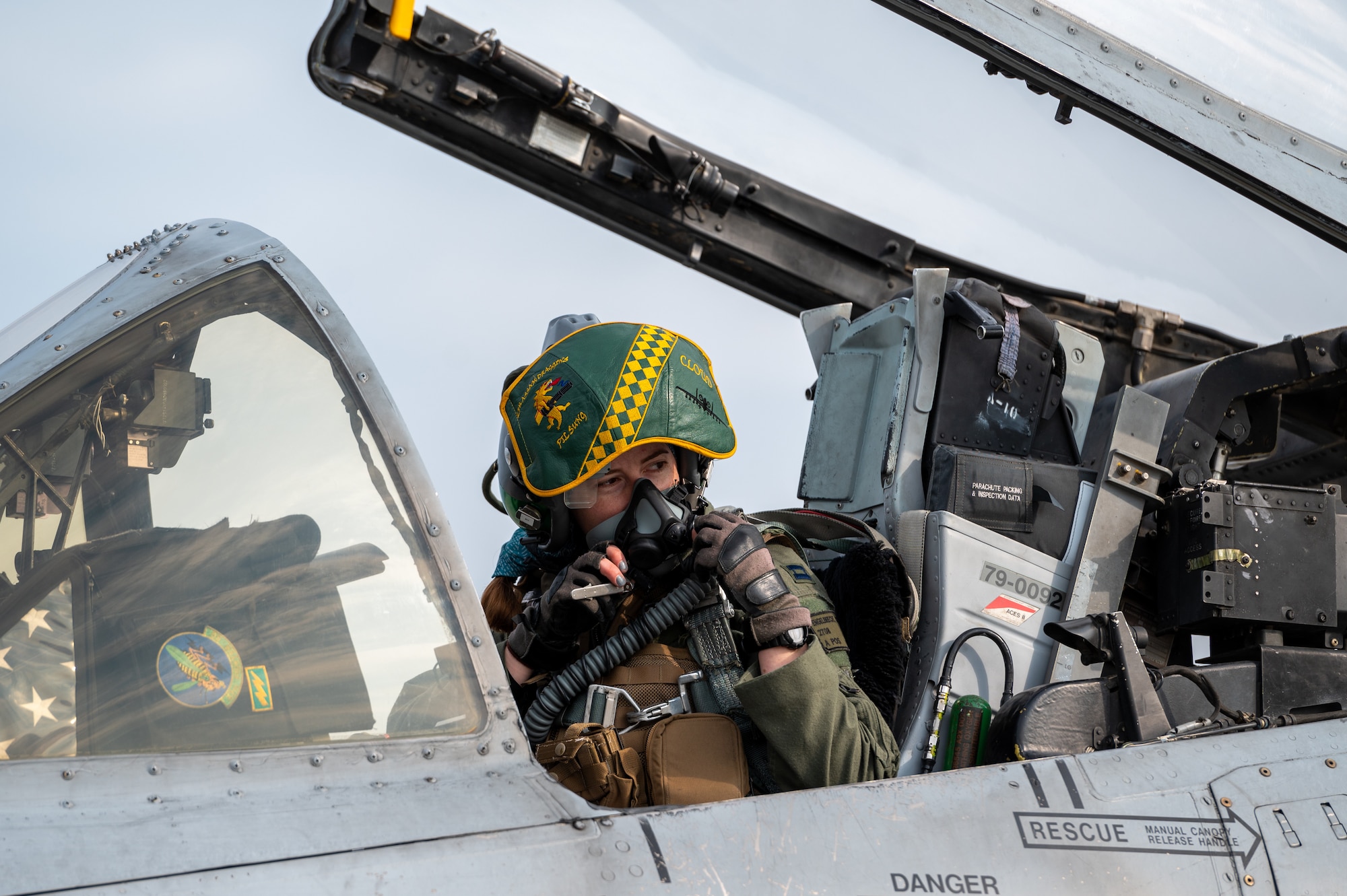 U.S. Air Force Capt. Colleen “Cloud” Engelbrecht, 25th Fighter Squadron pilot, checks in with her ground crew in an A-10 Thunderbolt II