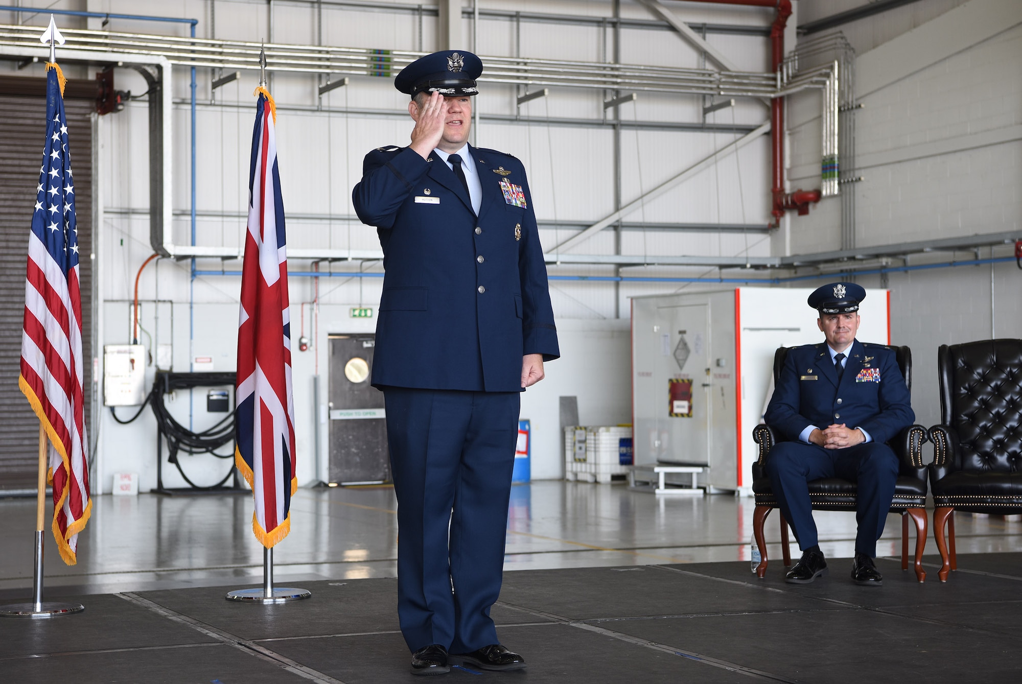 U.S. Air Force Col. Thomas Hutton, 100th Operations Group commander, renders his first salute to Airmen in the 100th OG during a change of command ceremony at Royal Air Force Mildenhall, England, June 16, 2022. Hutton joins the 100th Air Refueling Wing from Ramstein Air Base, Germany, and is a command pilot with more than 3,000 flying hours in tanker and trainer aircraft. (U.S. Air Force photo by Karen Abeyasekere)