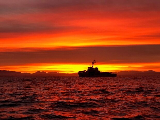 A view of the Coast Guard Cutter Steadfast at sunrise off the coast of San Diego, California., Dec. 2, 2019. The crew of the Steadfast was transiting north to their homeport of Astoria, Oregon, following a 60-day patrol in the Eastern Pacific Ocean. (U.S. Coast Guard photo by Petty Officer 1st Class Jonathan O'Connor.)