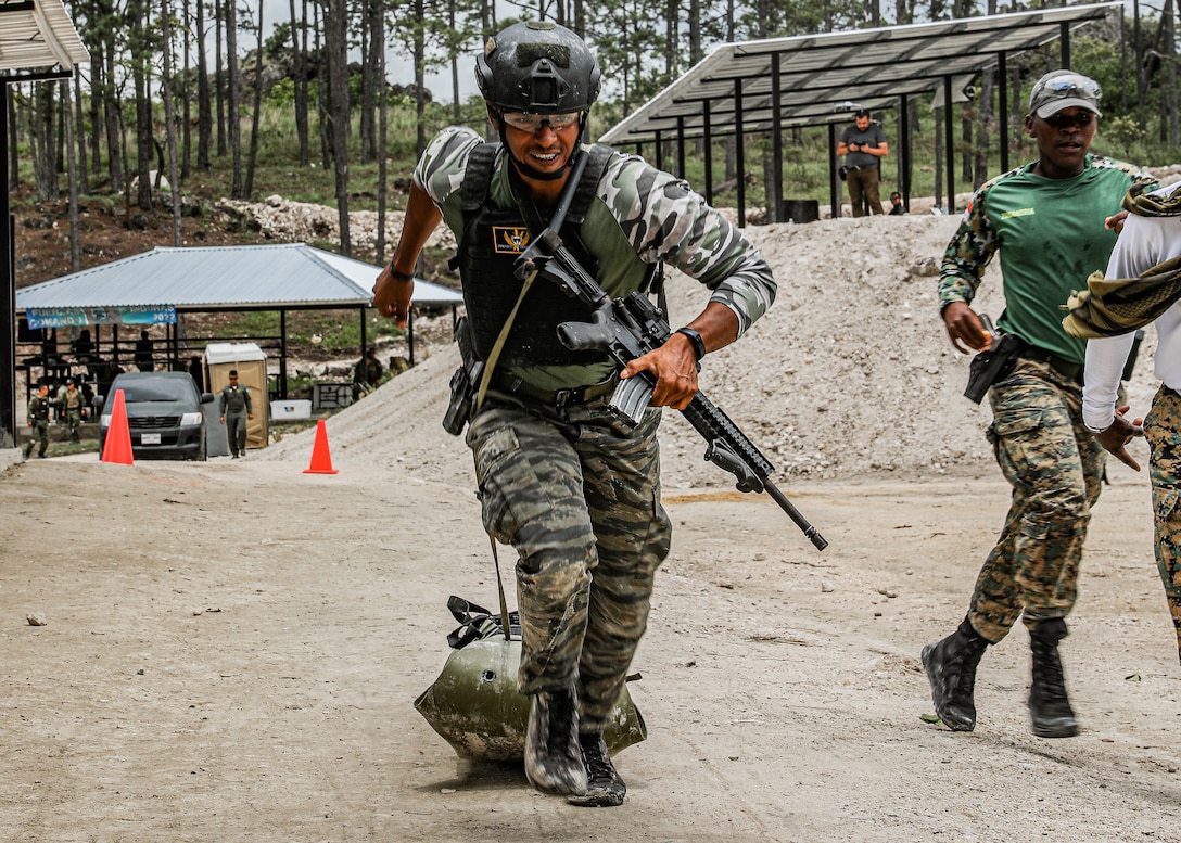 A Panamanian Soldier drags a sled during the assaulter stress test of the Fuerzas Comando 2022 competition in La Venta, Honduras on June 16, 2022.
