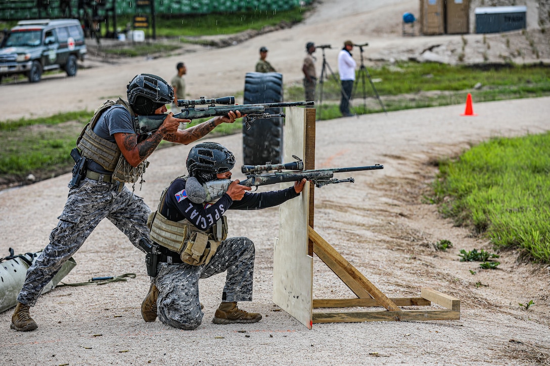 The Belizean sniper team compete during the Fuerzas Comando 2022 combined sniper assault course .