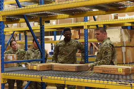 Louisiana Air National Guardsmen, from left, Airman 1st Class Emily Savoie, Staff Sgt. Julie Lobre, Tech. Sgt. Ryan Smith, receive hands on material management training from Pennsylvania Air National Guard Staff Sgt. Benjamin Bruce, right, a material handler with the 171st Air Refueling Wing, June 14, 2022. The training is part of a partnership between the 159th Fighter Wing’s Logistics Readiness Squadron and the 171st Air Refueling Wing.