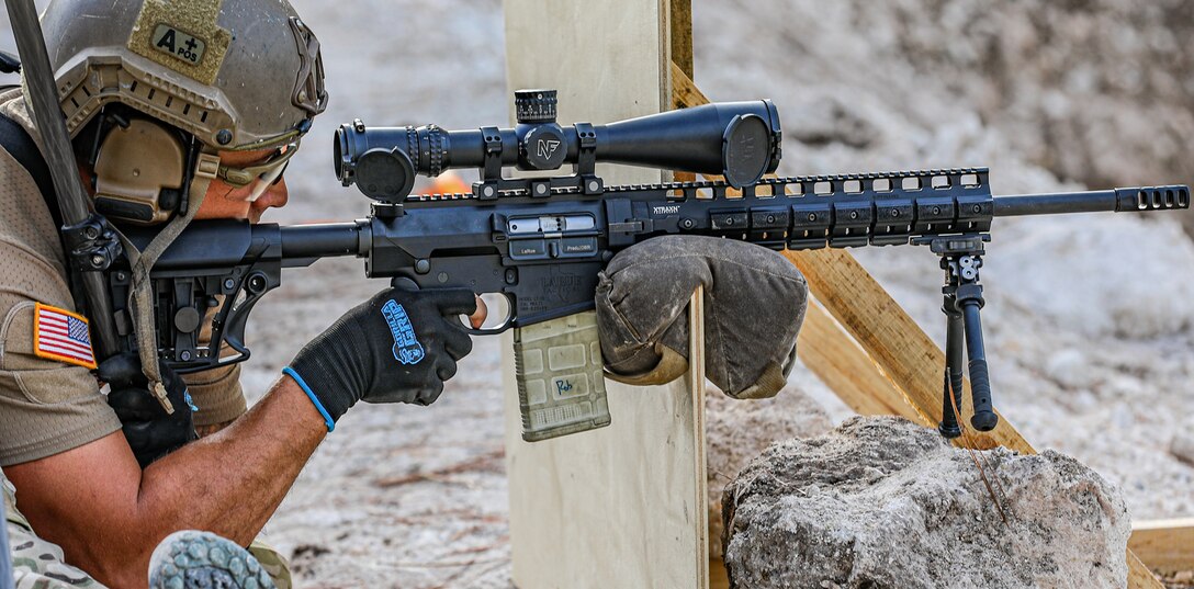 A United States team sniper prepares to fire downrange to begin the sniper stress test for the Fuerzas Comando 2022 competition.