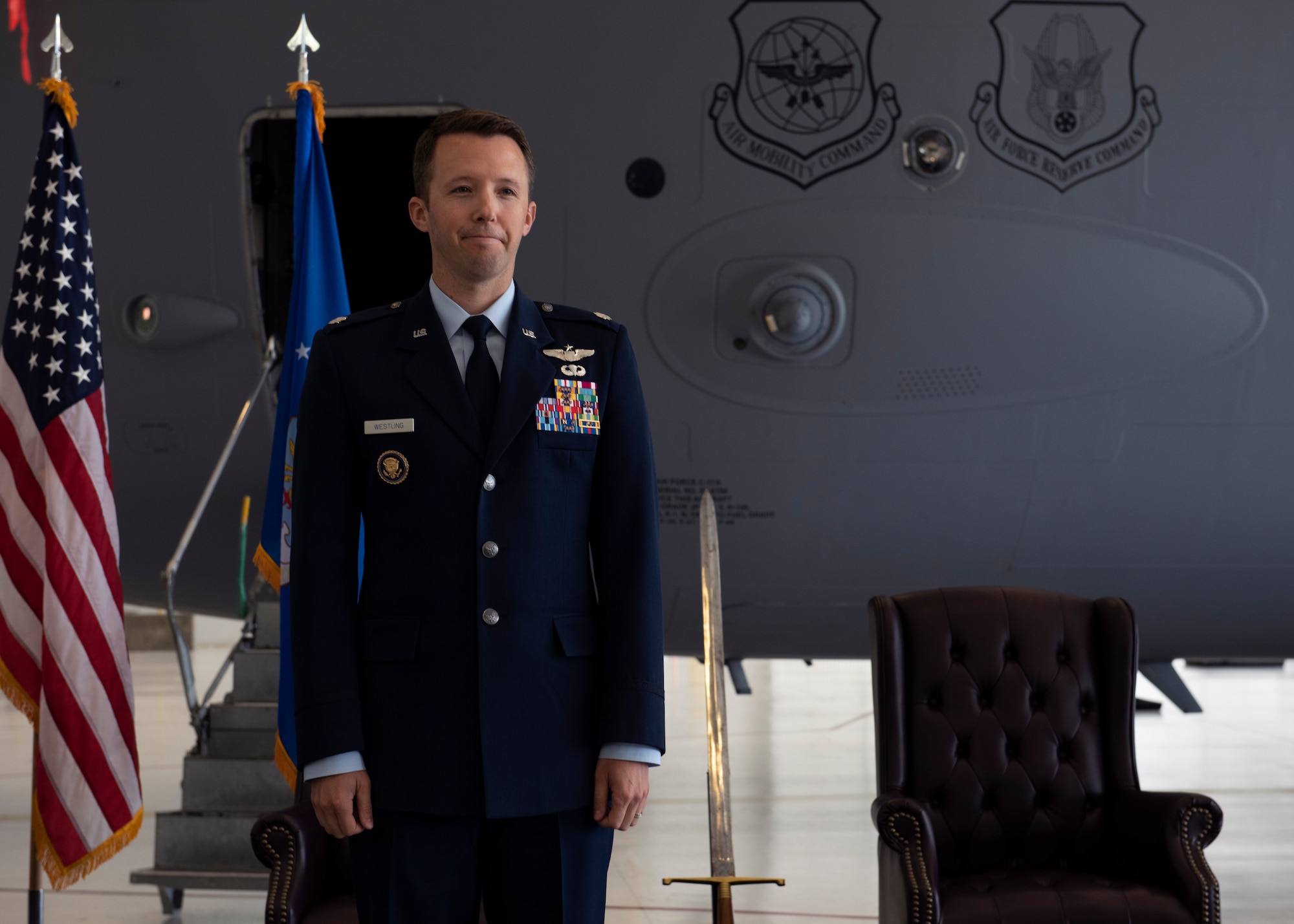 U.S. Air Force Lt. Col. Brandon Westling, commander of the 7th Airlift Squadron, prepares to render his first salute to members of the 7th AS during a change of command ceremony at Joint Base Lewis-McChord, Washington, June 16, 2022. Aircrews with the 7th AS operate the C-17 Globemaster III aircraft, directly supporting numerous U.S. government agencies and international forces in global operations from humanitarian/disaster relief to troop airlift/airdrop. (U.S. Air Force photo by Staff Sgt. Zoe Thacker)