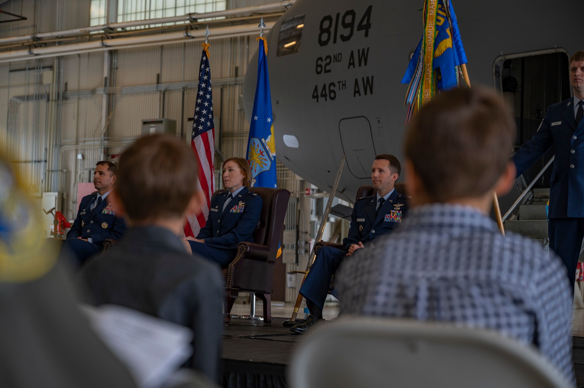 U.S. Air Force Col. Sergio Anaya, left, commander of the 62d Operations Group, Lt. Col. Susanne Lonsberry, center, outgoing commander of the 7th Airlift Squadron, and Lt. Col. Brandon Westling, incoming commander of the 7th AS, listen to remarks during the 7th AS change of command ceremony at Joint Base Lewis-McChord, Washington, June 16, 2022. Aircrews of the 7th AS operate the C-17 Globemaster III aircraft, directly supporting numerous U.S. government agencies and international forces in global operations ranging from troop airlift/airdrop to lifesaving medevac and humanitarian/disaster relief. (U.S. Air Force photo by Airman 1st Class Charles Casner)