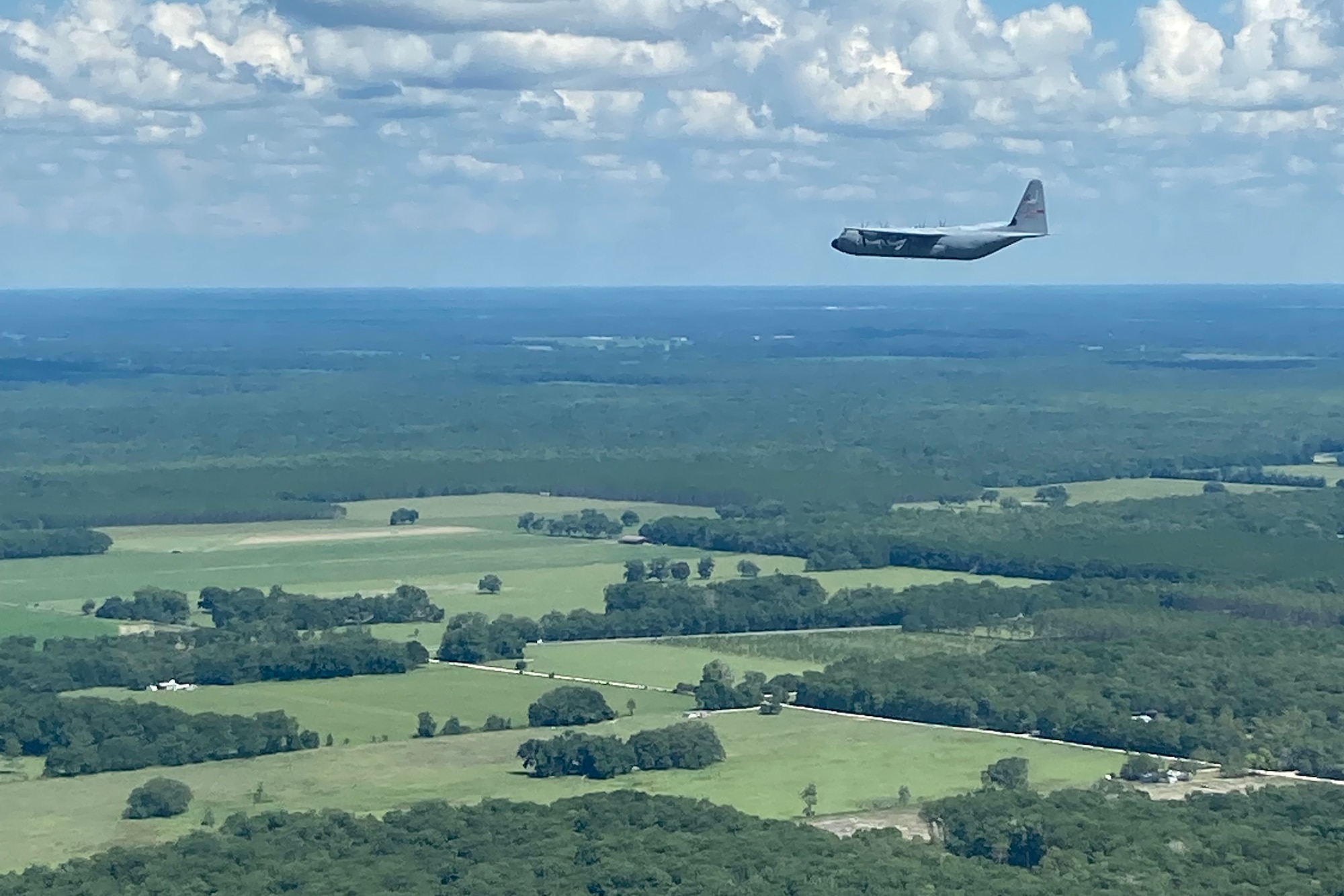 A C-130J Super Hercules assigned to 815th Airlift Squadron flies over a training area near Cape Canaveral, Fla.