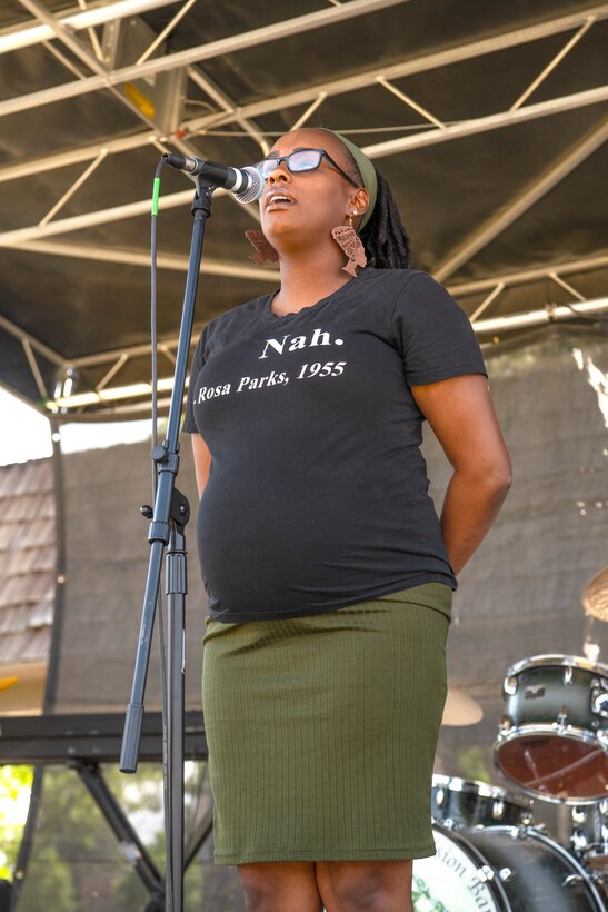 U.S. Air Force Airman 1st Class Colethea Collins, 21st Comptroller Squadron financial technician, sings the Black National Anthem “Lift Every Voice and Sing”, during  the Juneteenth festival at Peterson Space Force Base, Colorado, June 16, 2022.