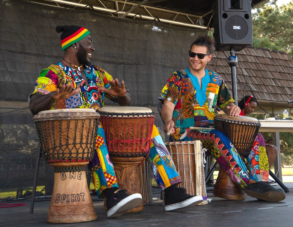 Members of the Soul Rhythm African Drumming group perform rhythmic drumming songs that reflect the music of West Africa during the Juneteenth festival at Peterson Space Force Base, Colorado, June 16, 2022.