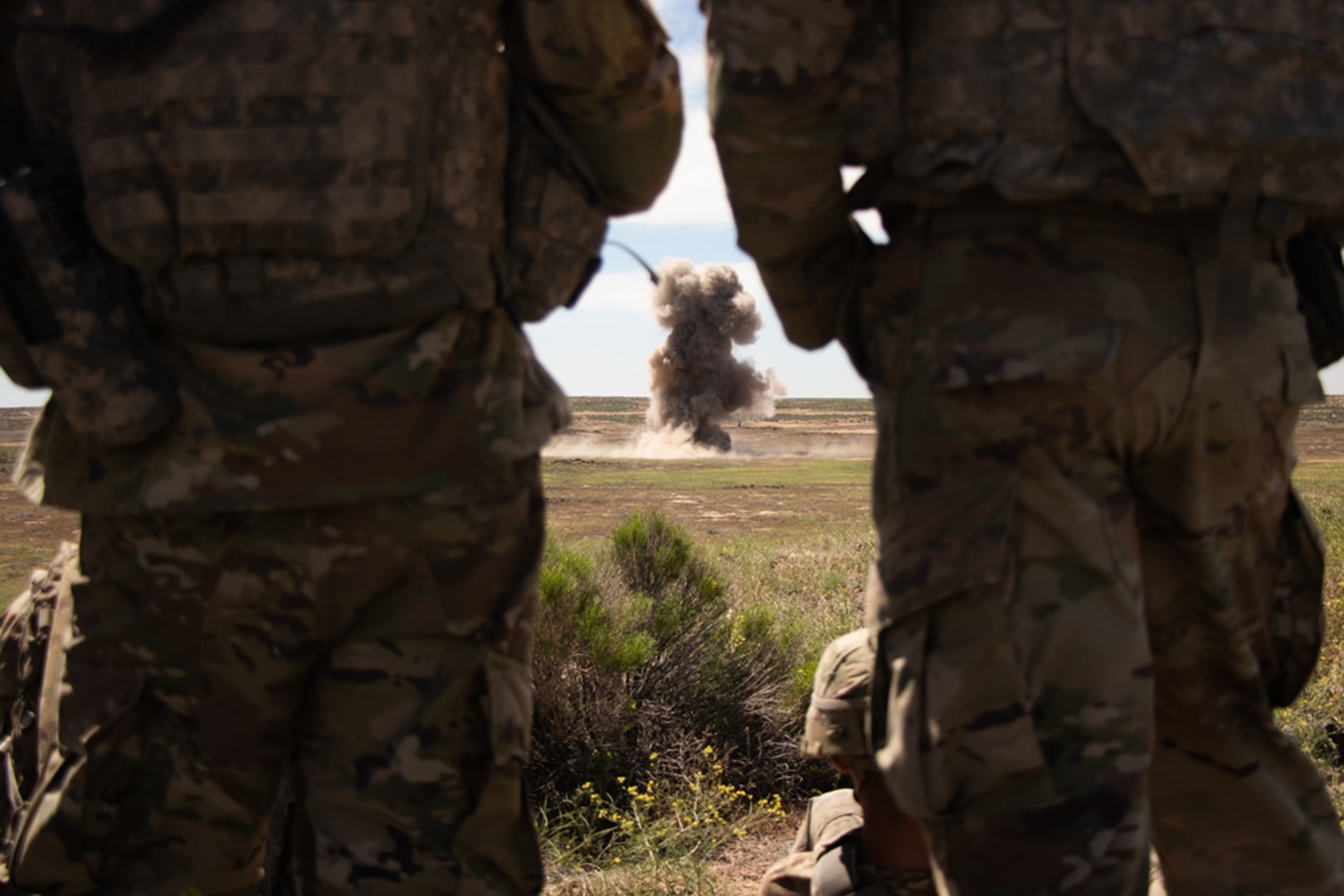 Combat engineers with the Iowa National Guard’s 833rd Engineer Company out of Ottumwa, Iowa, watch an explosion from a safe distance on a demolition range at Orchard Combat Training Center near Boise, Idaho, June 10, 2022. The Soldiers traveled to Idaho to take part in an exportable combat training capabilities exercise, or XCTC, called Western Strike.