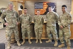 (from left) U.S. Air Force 2nd Lt. Edgar Alder, Airman 1st Class David Nguyen, Lt. Col. Stephanie Figueroa, Senior Airman Samuel Mundt, and Airman 1st Class Rakin Talukder celebrate the first official Signal Management System Mission Qualification Course to graduate from the 233rd Space Group - DET 1 / Combat Training System, March 25, 2022 at the 233rd Space Group, Greeley Air National Guard Station, Greeley, Colorado. The course makes up a portion of the Integrated AN/ TLQ-34 Communications Satellite Countermeasure Set. (U.S. Air National Guard photo by Staff Sgt. Chastity Lollis)
