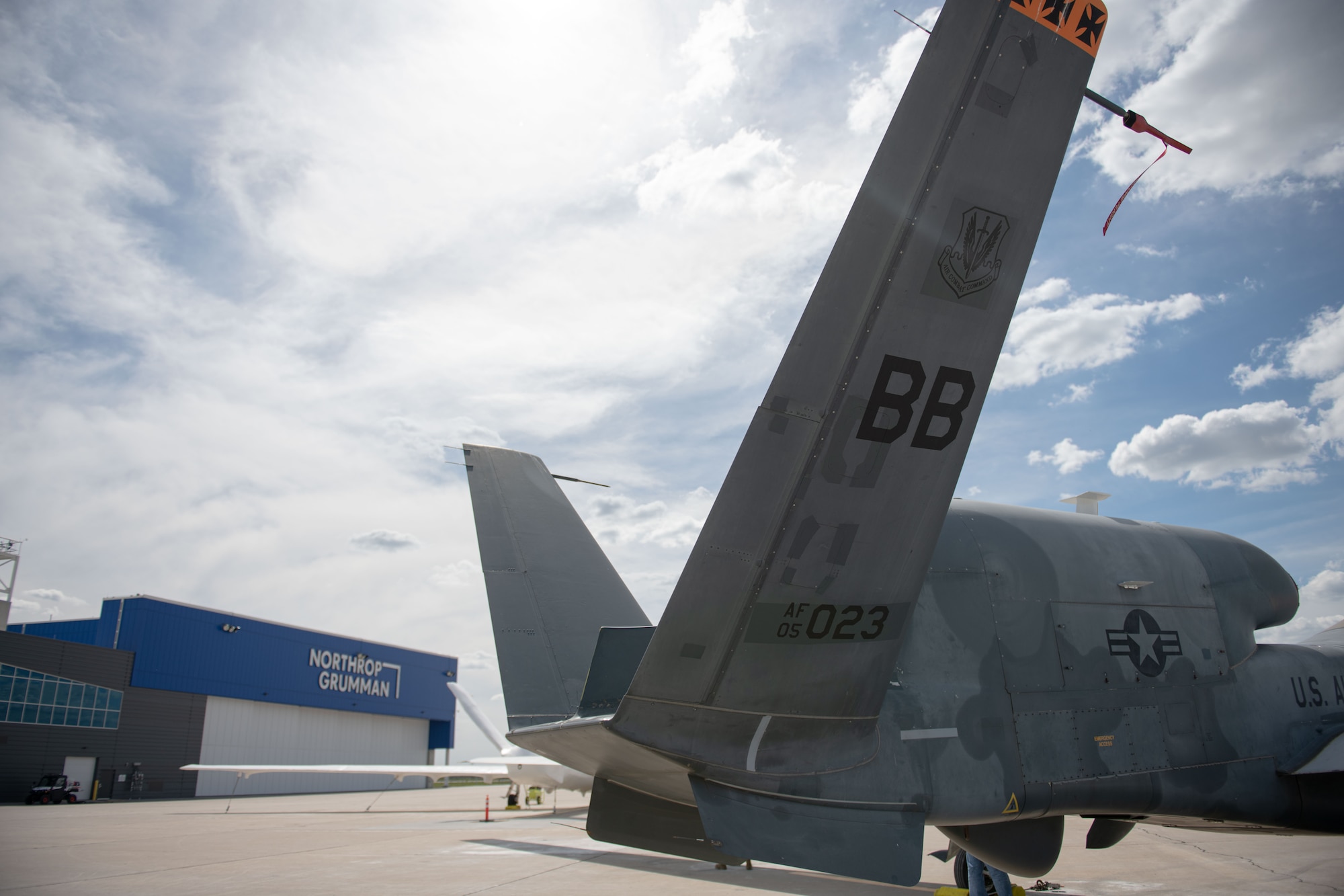 An RQ-4 Block 30 Global Hawk remotely piloted aircraft sits outside the Northrop Grumman hangar at Grand Sky on Grand Forks Air Force Base, North Dakota, June 6, 2022. This was the first of five RQ-4 Block 30s to be transferred to Grand Sky to be outfitted with different sensor technology and begin operating as a part of the Test Resource Management Center’s High Speed System Test department. Located on Grand Forks Air Force Base, Grand Sky is a business and aviation park focused on developing and growing the unmanned aerial systems industry. (U.S. Air Force photo by Senior Airman Ashley Richards)
