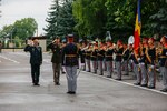 Army Gen. Daniel Hokanson, chief, National Guard Bureau, is greeted by a Moldovan military band at the Ministry of Defense headquarters in Chisinau, Moldova, June 10, 2022. Hokanson joined Army Maj. Gen. Todd Hunt, the adjutant general, North Carolina National Guard, to recognize Moldova's 23-year security cooperation with North Carolina.